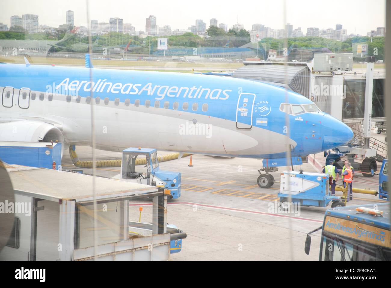 Buenos Aires, Argentina, November 18, 2022: Aerolineas Argentinas airplane as seen from a boarding bridge window of the Jorge Newbery Airport Stock Photo