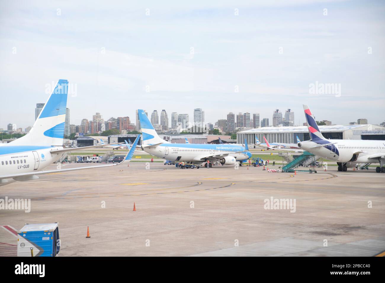 Buenos Aires, Argentina, November 18, 2022: Aerolineas Argentinas, Austral and Latam airplanes at the aircraft boarding area of the Jorge Newbery Inte Stock Photo