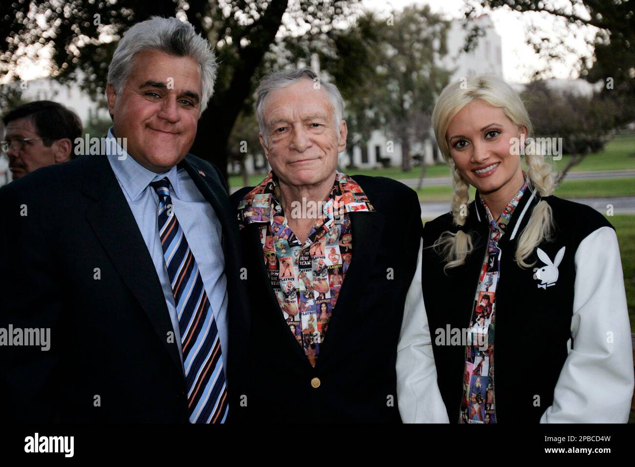 Jay Leno, left, Hugh Hefner and Holly Madison pose for photographs at the  80th birthday Sahl-ute to comic Mort Sahl, Thursday, June 28, 2007, in  Los Angeles. (AP PhotoAnn Johansson Stock Photo -