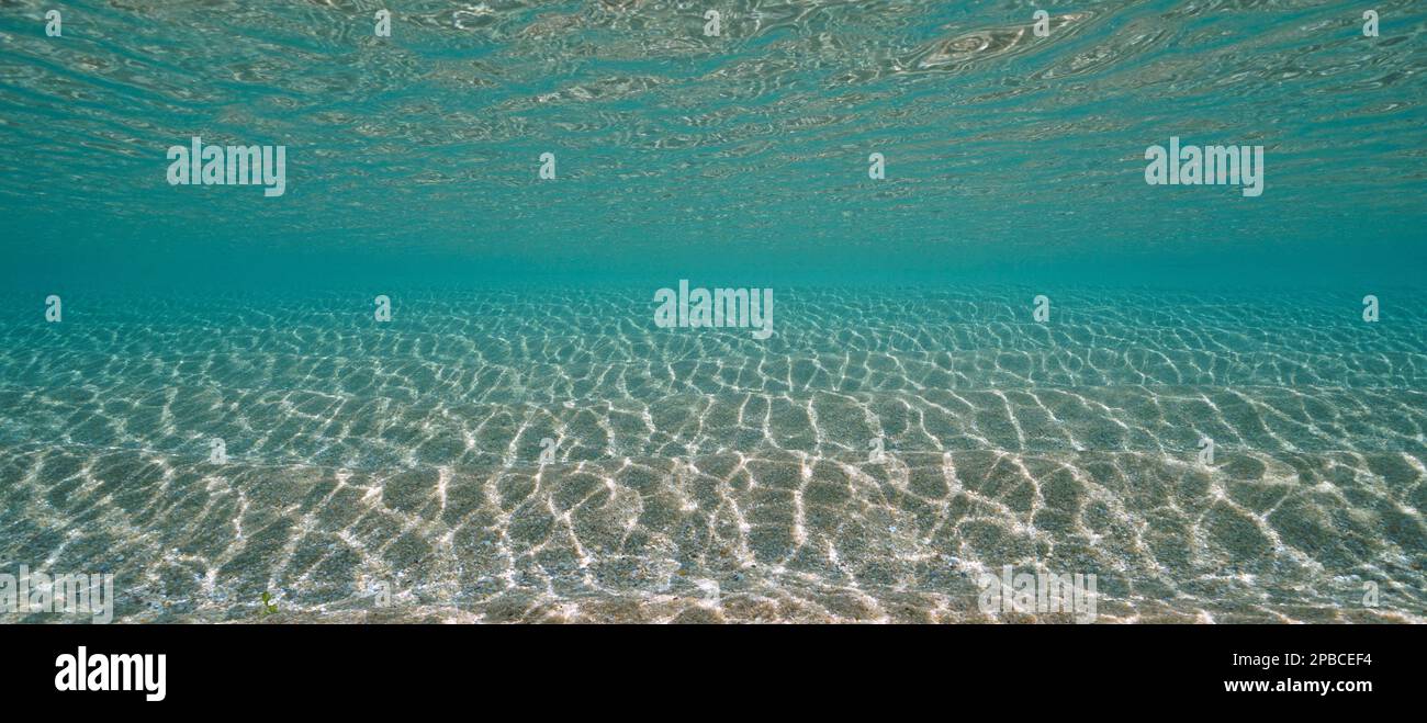 Ripples of sand and water surface underwater in the Atlantic ocean in shallow water, natural scene, Spain Stock Photo
