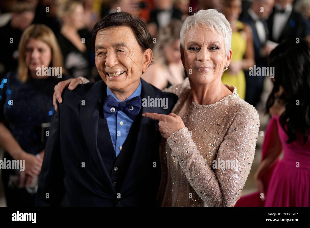 James Hong, left, and Jamie Lee Curtis arrive at the Oscars on Sunday