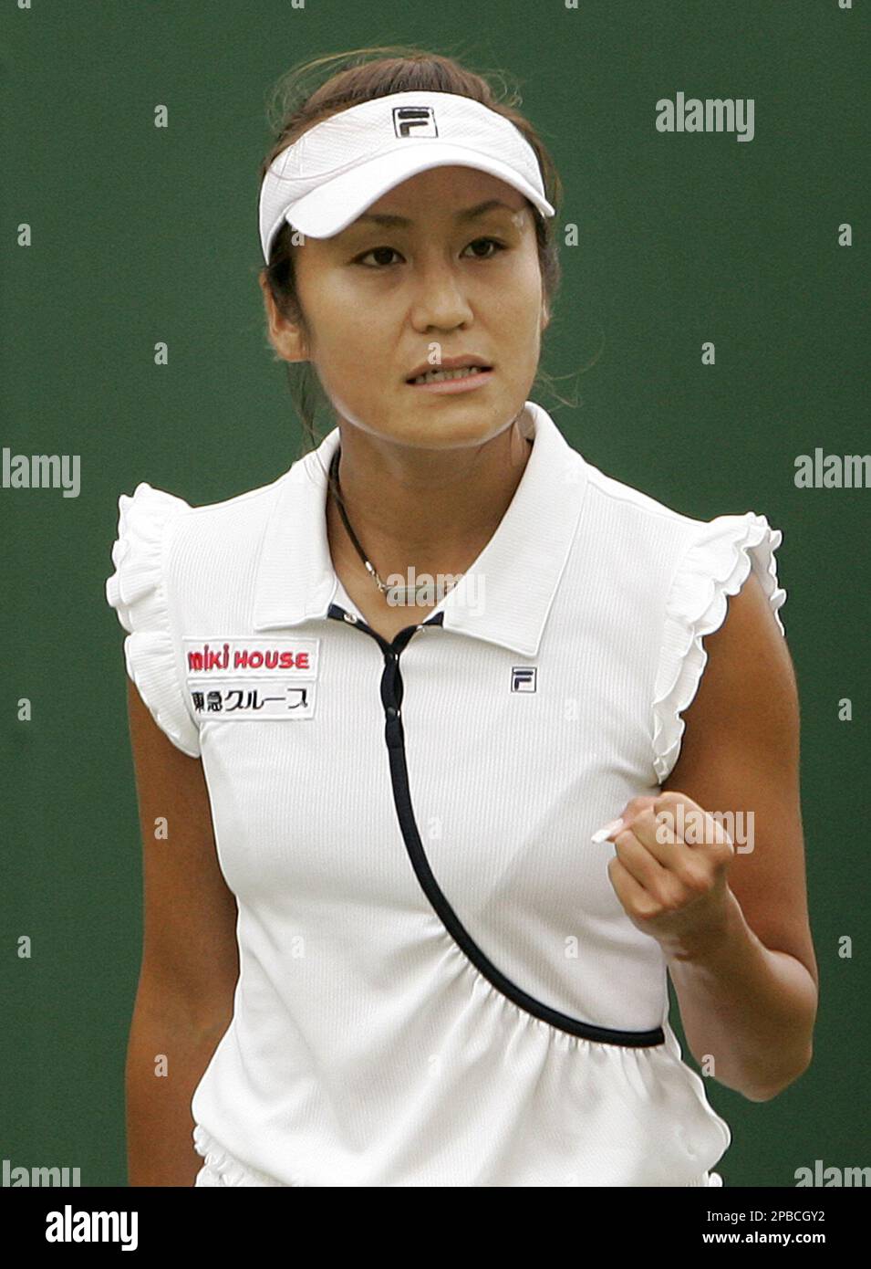 Japan's Akiko Morigami reacts as she plays Italy's Alberta Brianti during a Women's Singles match at Wimbledon, Wednesday June 27, 2007. (AP Photo/Kirsty Wigglesworth) ** EDITORIAL USE ONLY ** Stock Photo
