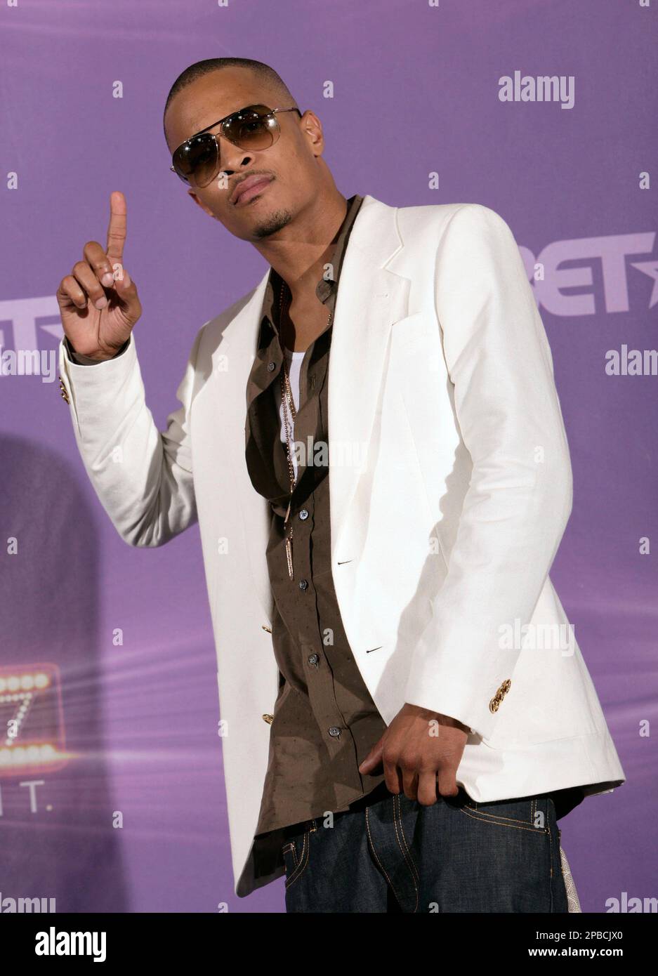 T.I. poses after winning the award for best male hip-hop artist at the ...