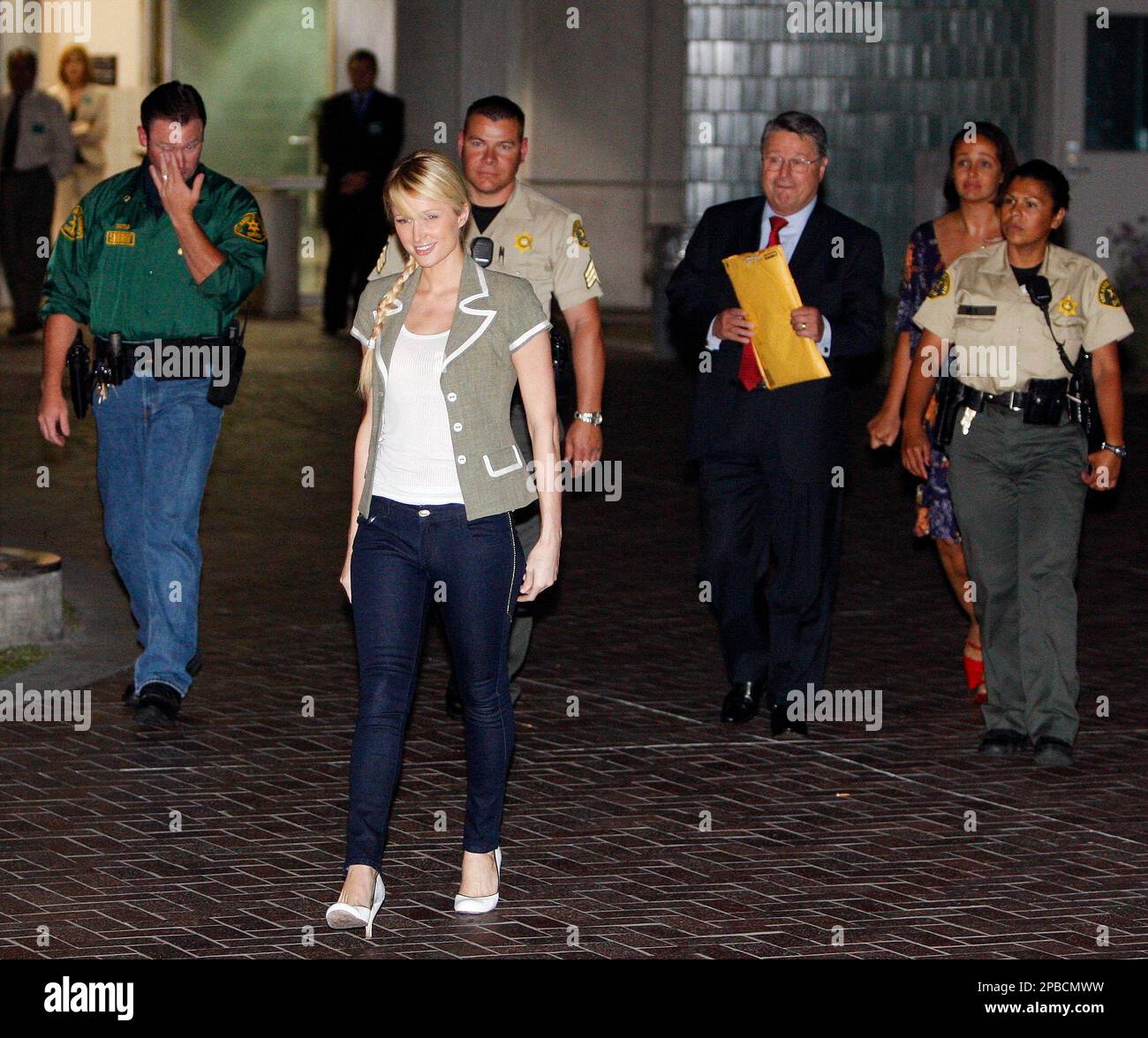 Paris Hilton escorted by Los Angeles County Sheriff deputies walks out(02)