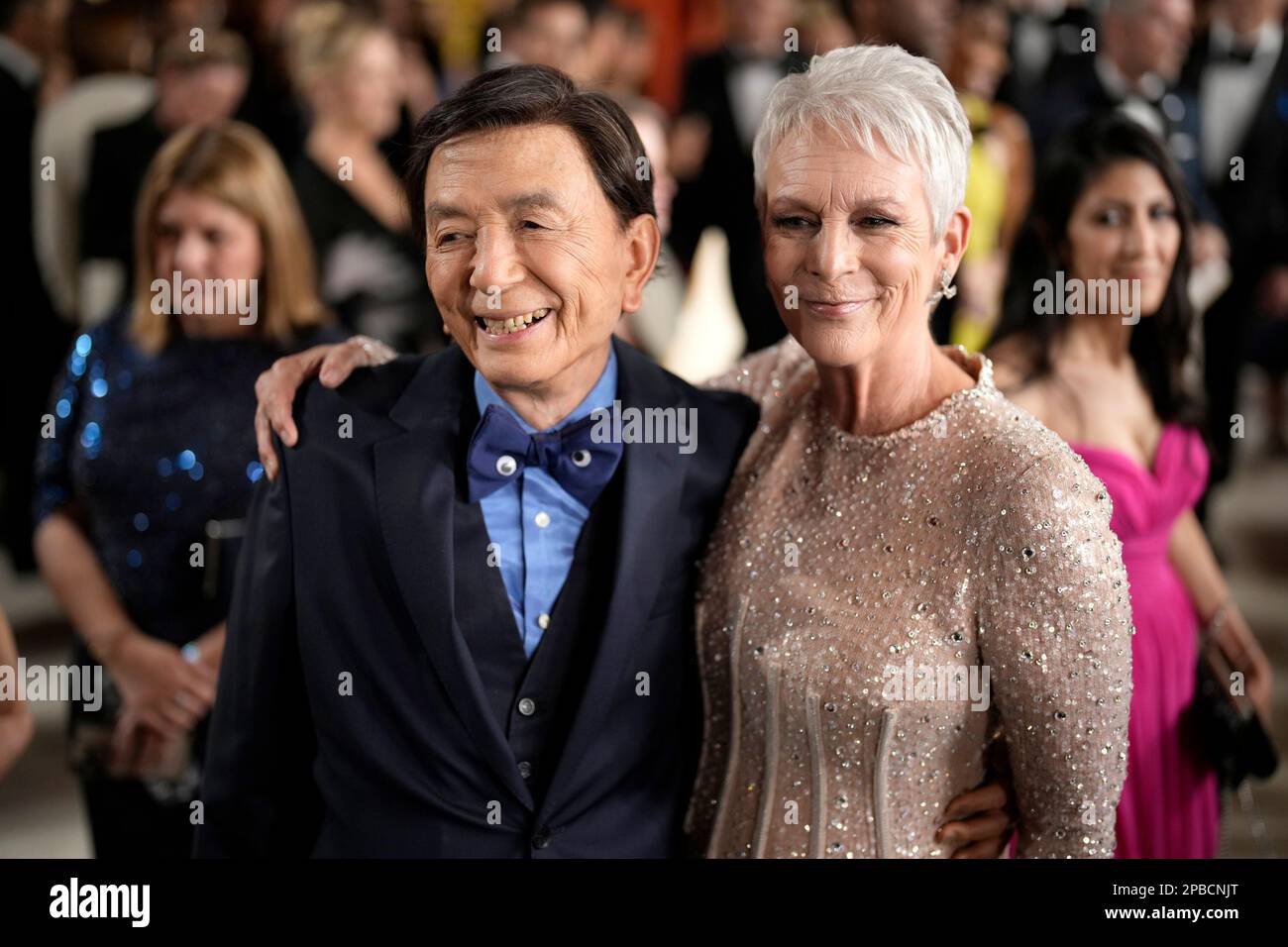 James Hong, left, and Jamie Lee Curtis arrive at the Oscars on Sunday