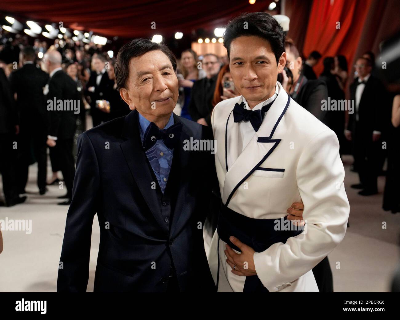James Hong, left, and Harry Shum Jr. arrive at the Oscars on Sunday