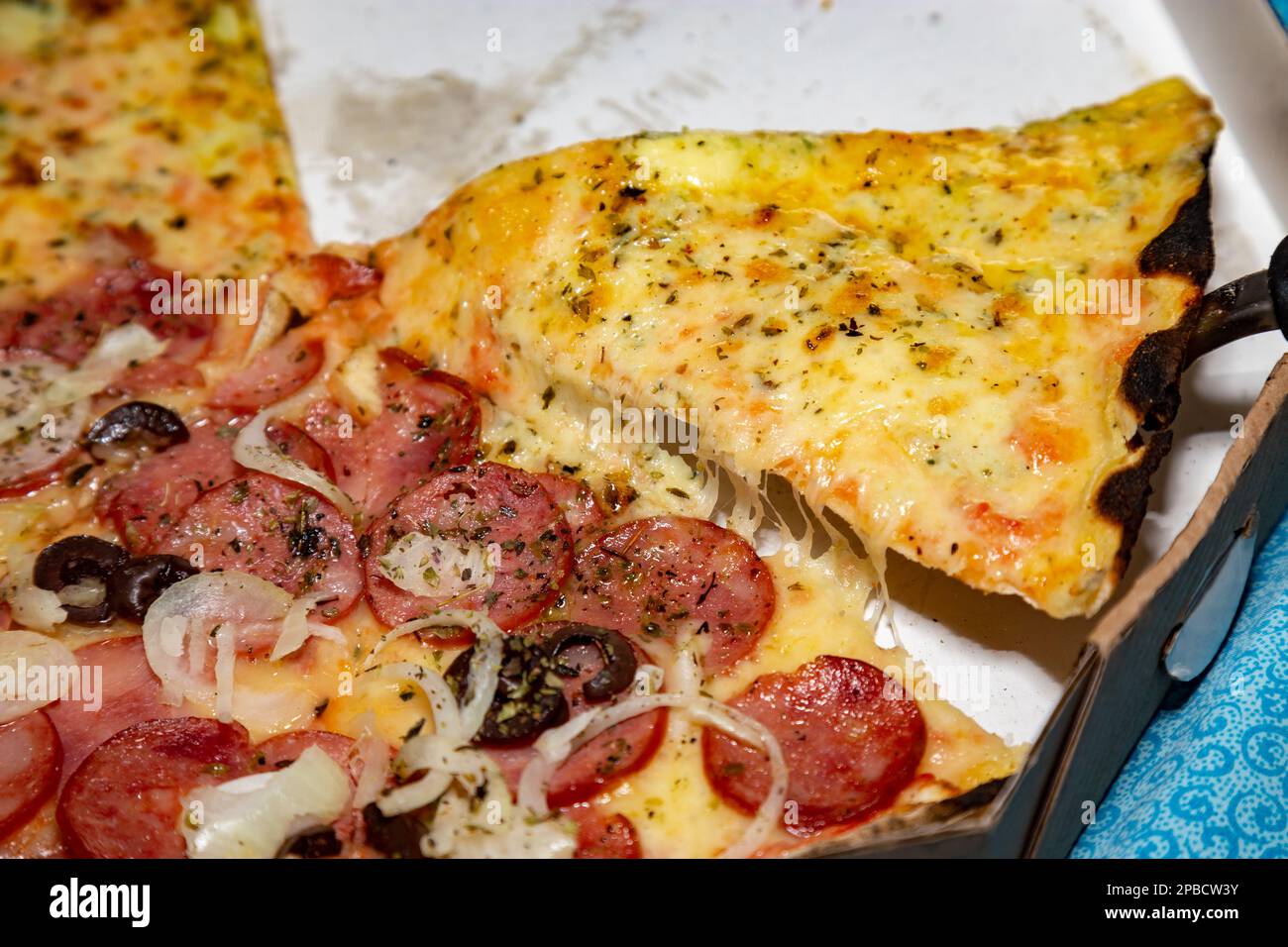 Traditional Brazilian pizza half pepperoni sausage and half four