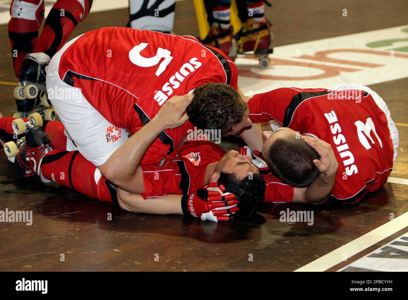 Swiss Matthieu Bertini, left, Federico Garcia-Mendez, center, and Gael  Jimenez, right, celebrate the victory after their semifinal match against  Argentina at the 38th Roller Hockey World Championship in Montreux,  Switzerland, Friday, June