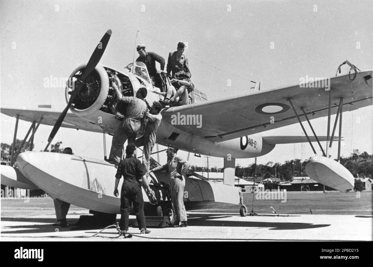 Engineers check out The Polar Star, a single-engine Vought-Sikorsky Kingfisher floatplane bound for Antarctica on board the HMAS Wyatt Earp in 1947-48. Stock Photo
