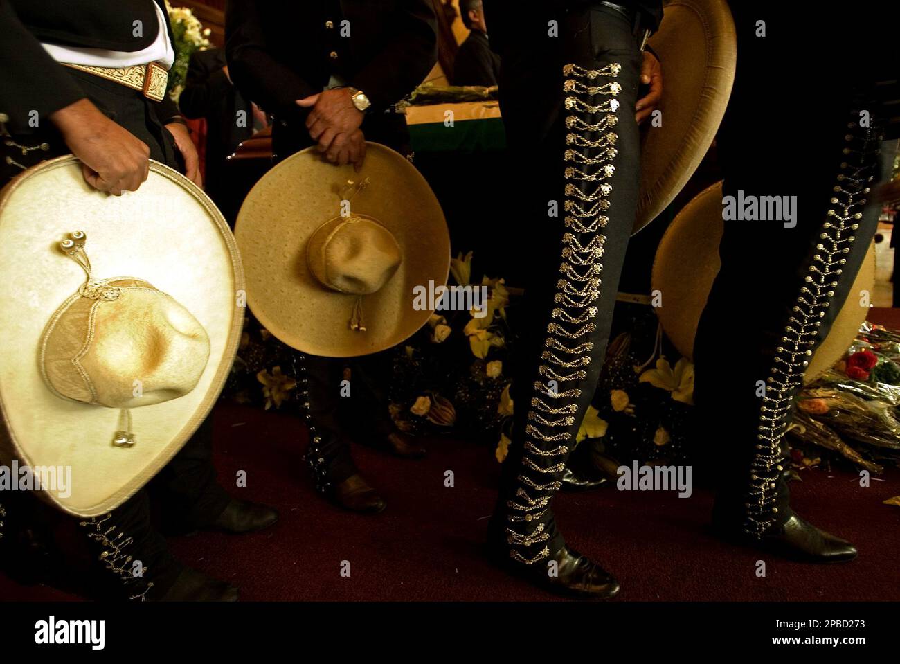 Charros stand next to the coffin of the late Mexican mariachi singer
