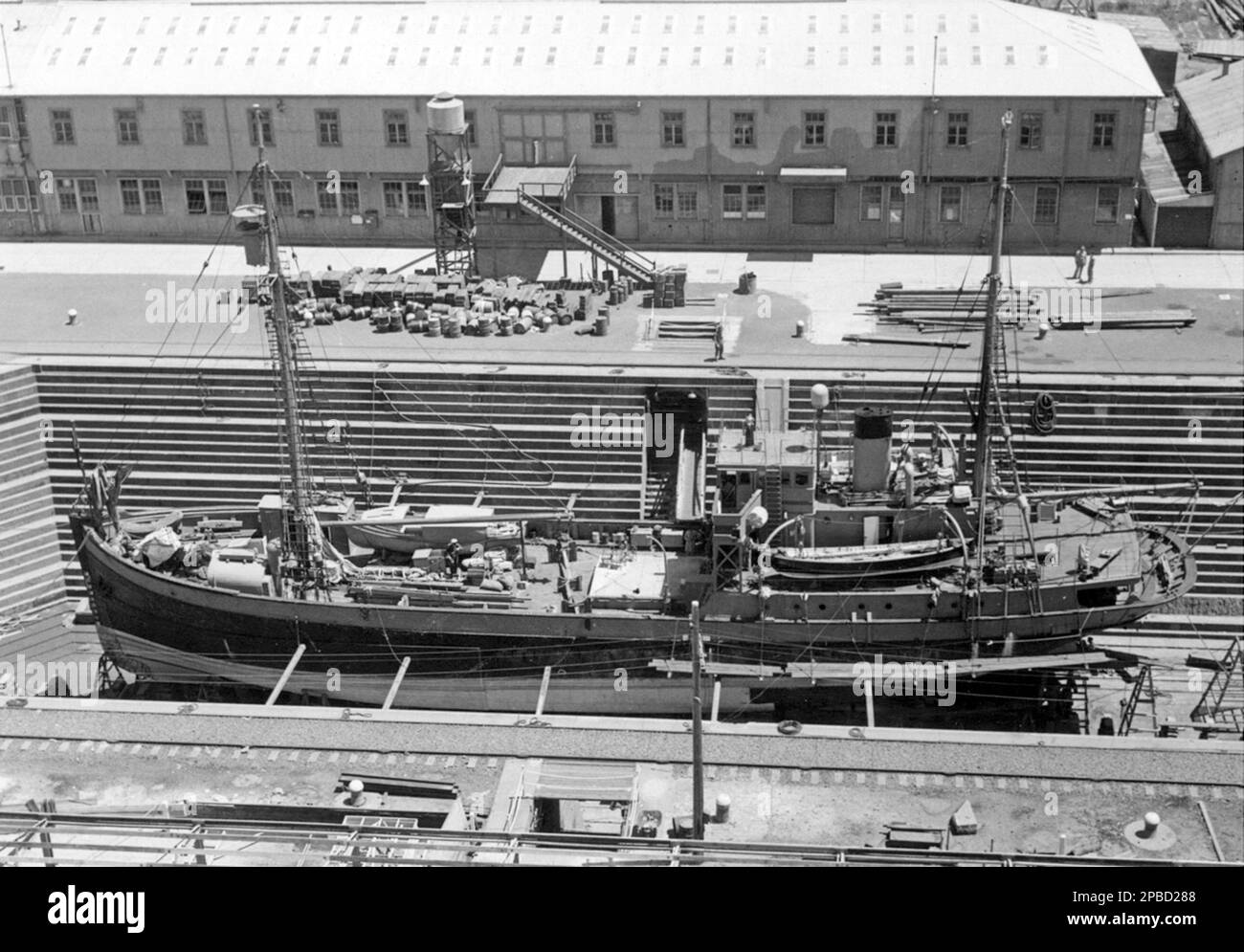 HMAS Wyatt Earp in drydock for repairs. The ship was constructed as a single-deck motor vessel named FV Fanejord, built from pine and oak for the Norwegian herring fishing trade. She was purchased by the American explorer and aviator, Lincoln Ellsworth, for his 1933 Antarctic expedition, refitted and sheathed with oak and armour plate, and renamed Wyatt Earp. She was used on four of Ellsworth's Antarctic expeditions between 1933 and 1939, primarily as a base ship for his aircraft. Stock Photo