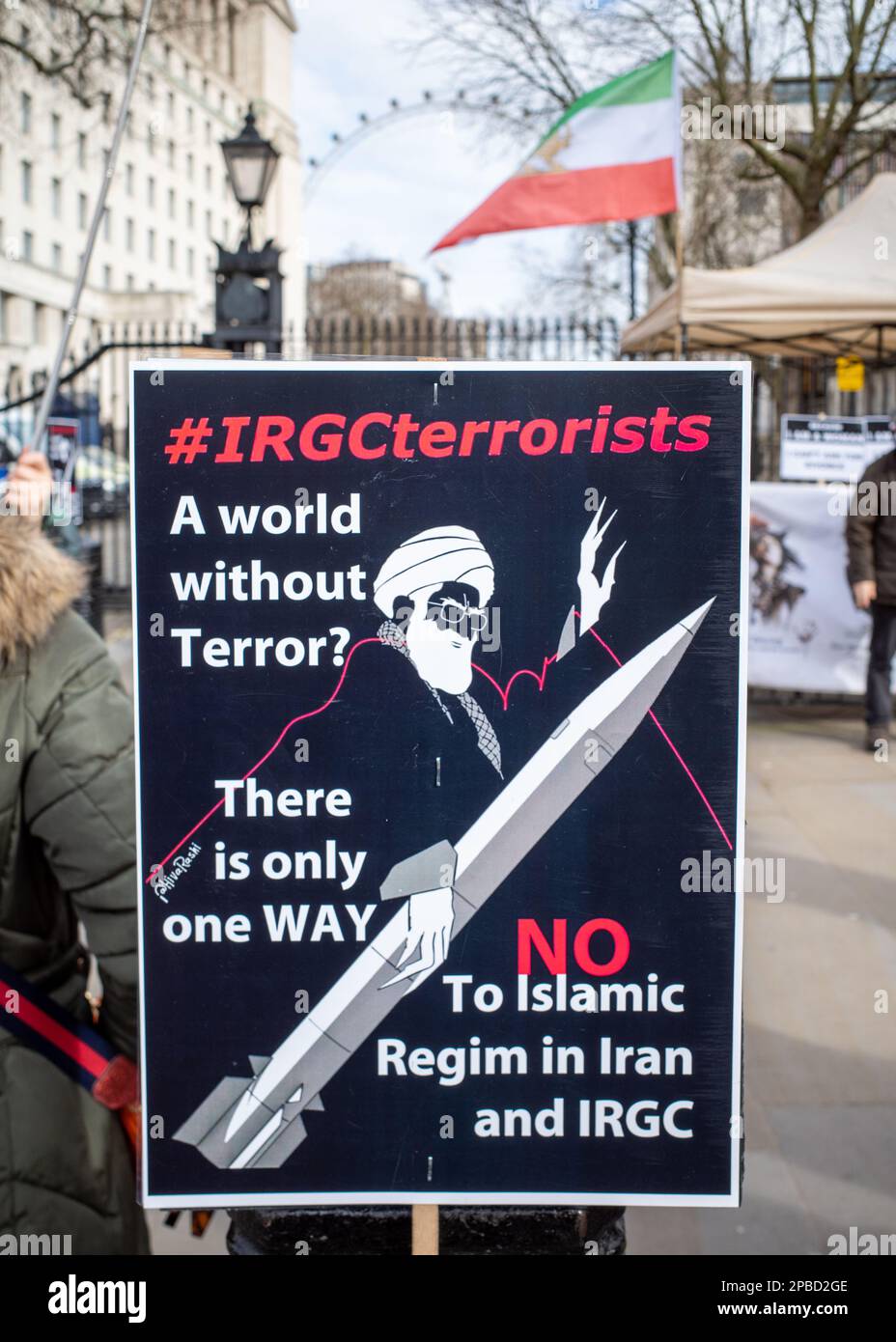 Protest poster in London against 'Islamic Revolutionary Guard Corps' (IRGC) - terrorists, No to Islamic Regime - depicting Ali Khamenei on a missile. Stock Photo