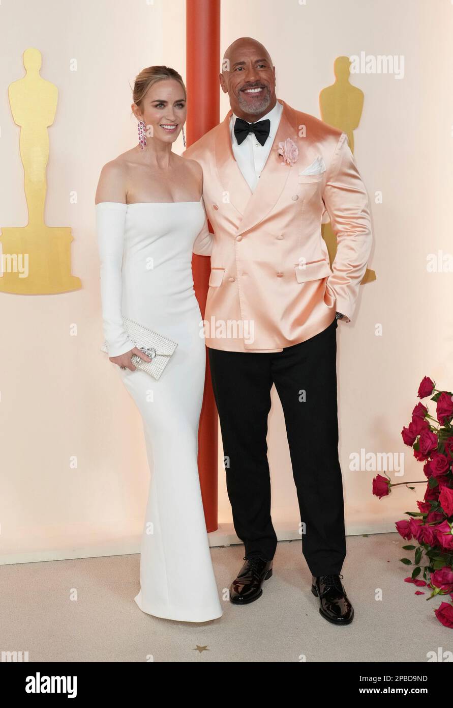 Emily Blunt, left, and Dwayne Johnson arrive at the Oscars on Sunday