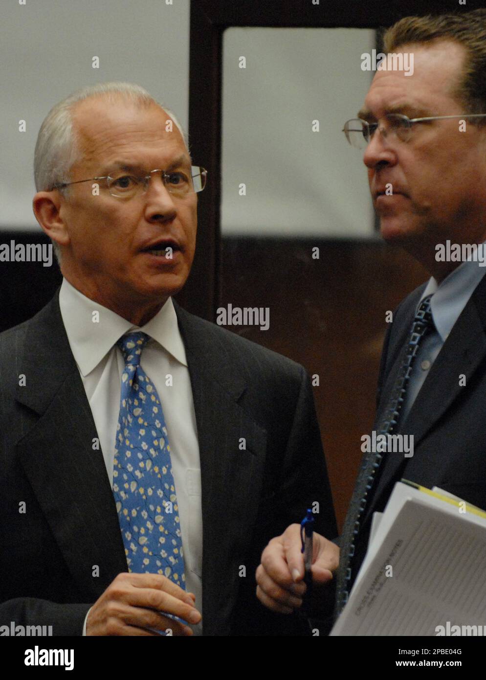 Defense attorneys Roger Rosen, left, and Christopher Plourd talk during ...