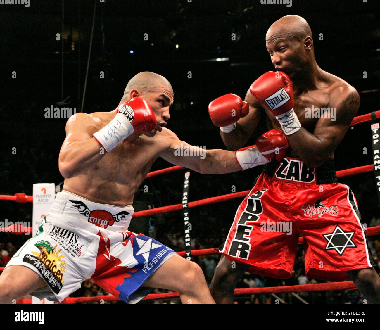 Miguel Cotto, of Puerto Rico,lands a body punch during the first round of  boxing action for the WBA Welterweight Championship Saturday, June 9, 2007  at Madison Square Garden in New York. Cotto, image size:1300x1129