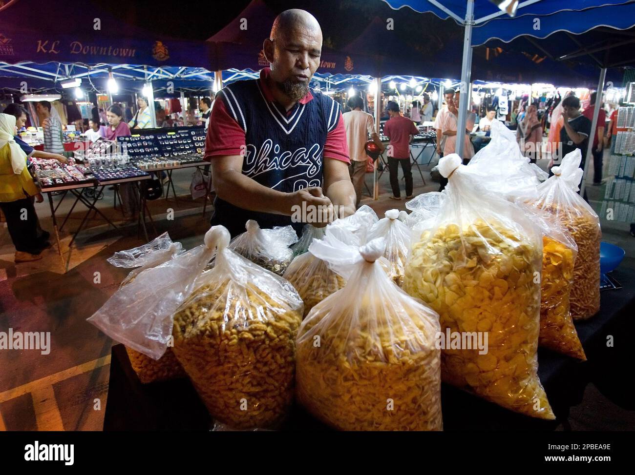 Mohamad Yusof Othman, a former drug pusher and user prepares his snack