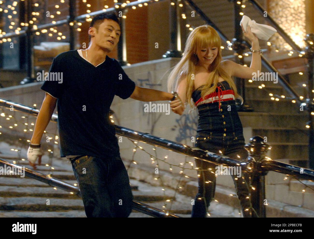 Japanese singer Ayumi Hamasaki, right, acts with Hong Kong