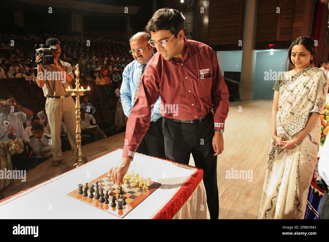 Aruna Anand, wife of Indian chess grandmaster Viswanathan Anand, right,  gives him a piece of cake during her birthday celebrations in Gauhati,  India, Thursday, June 30, 2005. (AP Photo/Anupam Nath Stock Photo 