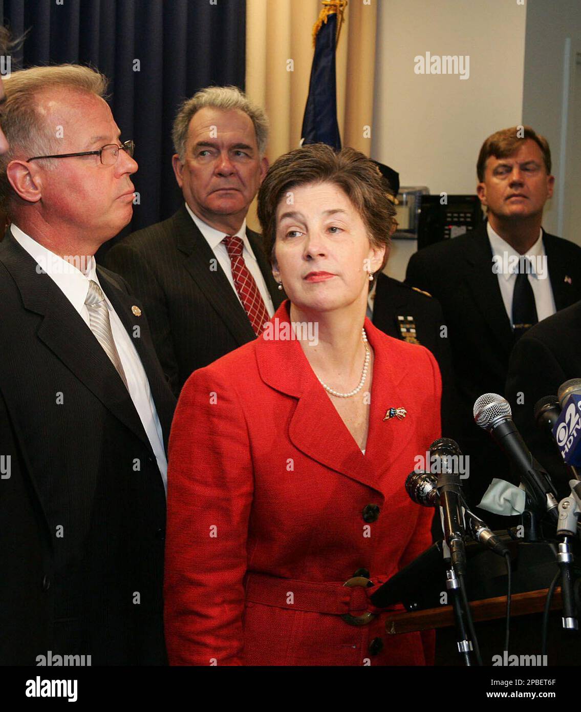 U.S. Attorney Roslynn R. Mauskopf, center, appears at an FBI news conference in New York, Saturday, June 2, 2007. Three people were arrested and one other was being sought Saturday in connection to a plan to set off explosives in a fuel line that feeds John F. Kennedy International Airport and runs through residential neighborhoods, officials close to the investigation said. (AP Photo/John Marshall Mantel) Stock Photo