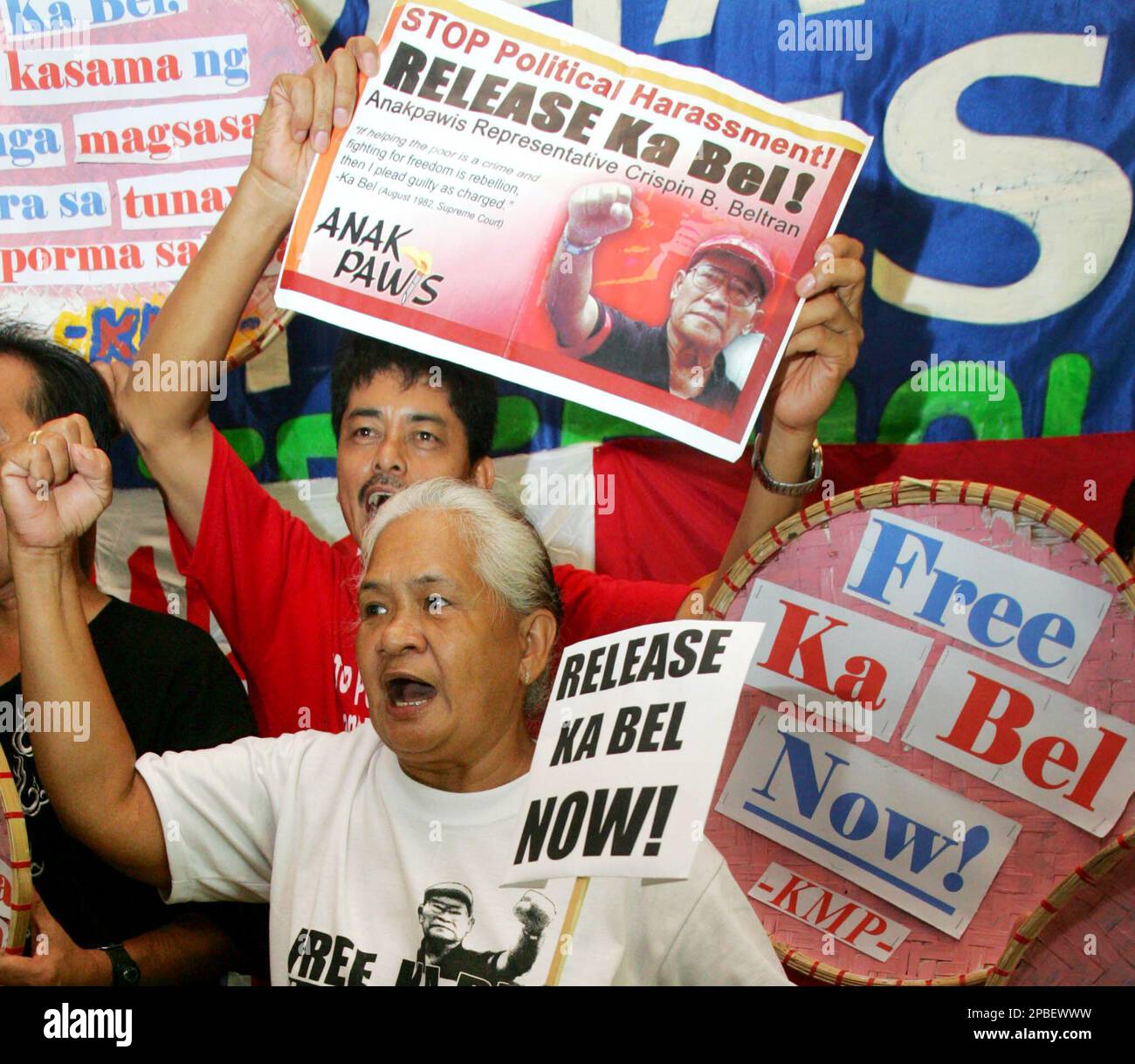 Rosario Beltran wife of detained leftist lawmaker Crispin Beltran, leads her supporters as they demand his immediate release during a press conference Saturday, June 2, 2007 in suburban Quezon City, north of Manila, Philippines. The Philippine Supreme Court threw out rebellion charges against six left-wing opposition lawmakers and four activists, warning the justice secretary and government prosecutors against using their powers for political ends. (AP Photo/Pat Roque) Stock Photo