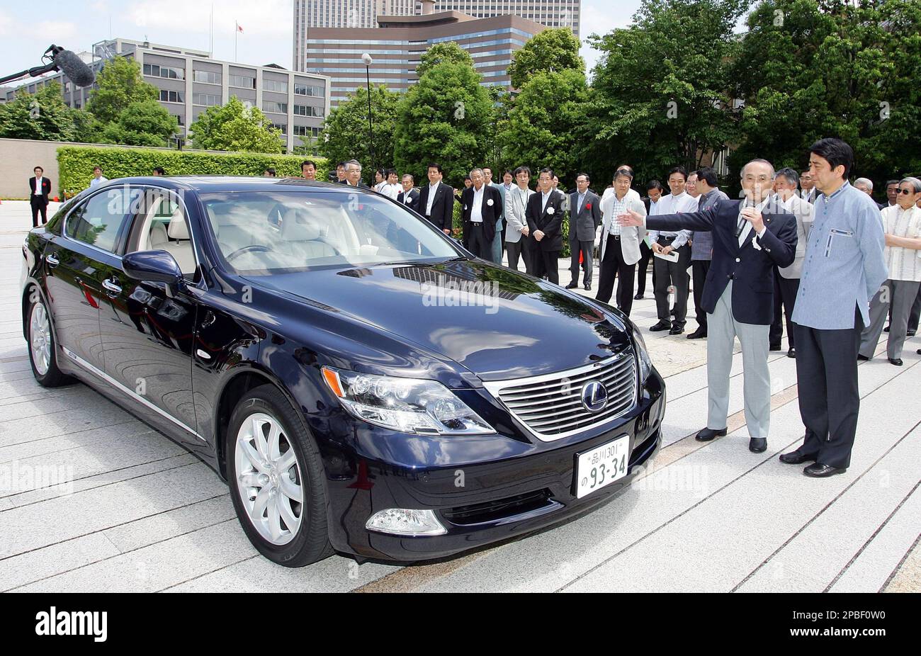 Japanese Prime Minister Shinzo Abe, right, listens to Japanese Prime Minister Shinzo Abe, right, listens to