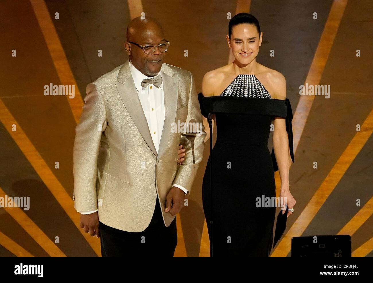 Samuel L. Jackson, left, and Jennifer Connelly present the award for best  makeup and hairstyling at the Oscars on Sunday, March 12, 2023, at the  Dolby Theatre in Los Angeles. (AP Photo/Chris