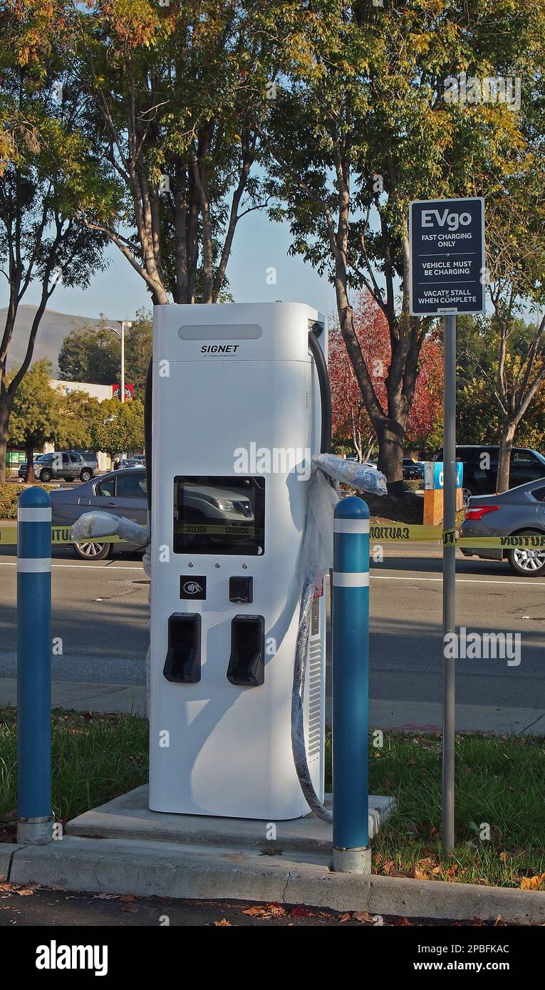 Electric vehicle fast charging stations in a shopping center parking