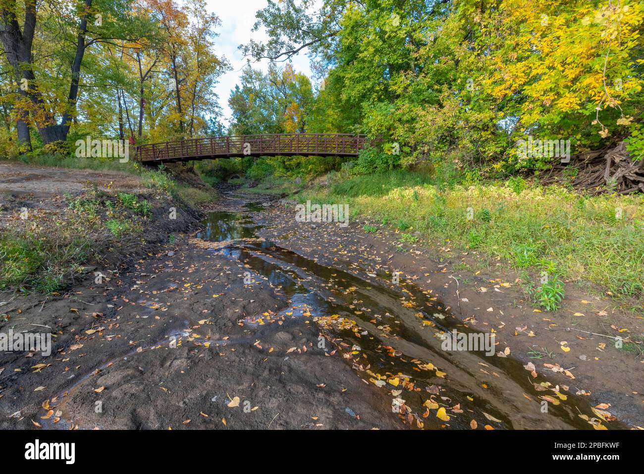 Dried up Springbrook Creek in Fridley Minnesota displays the drought