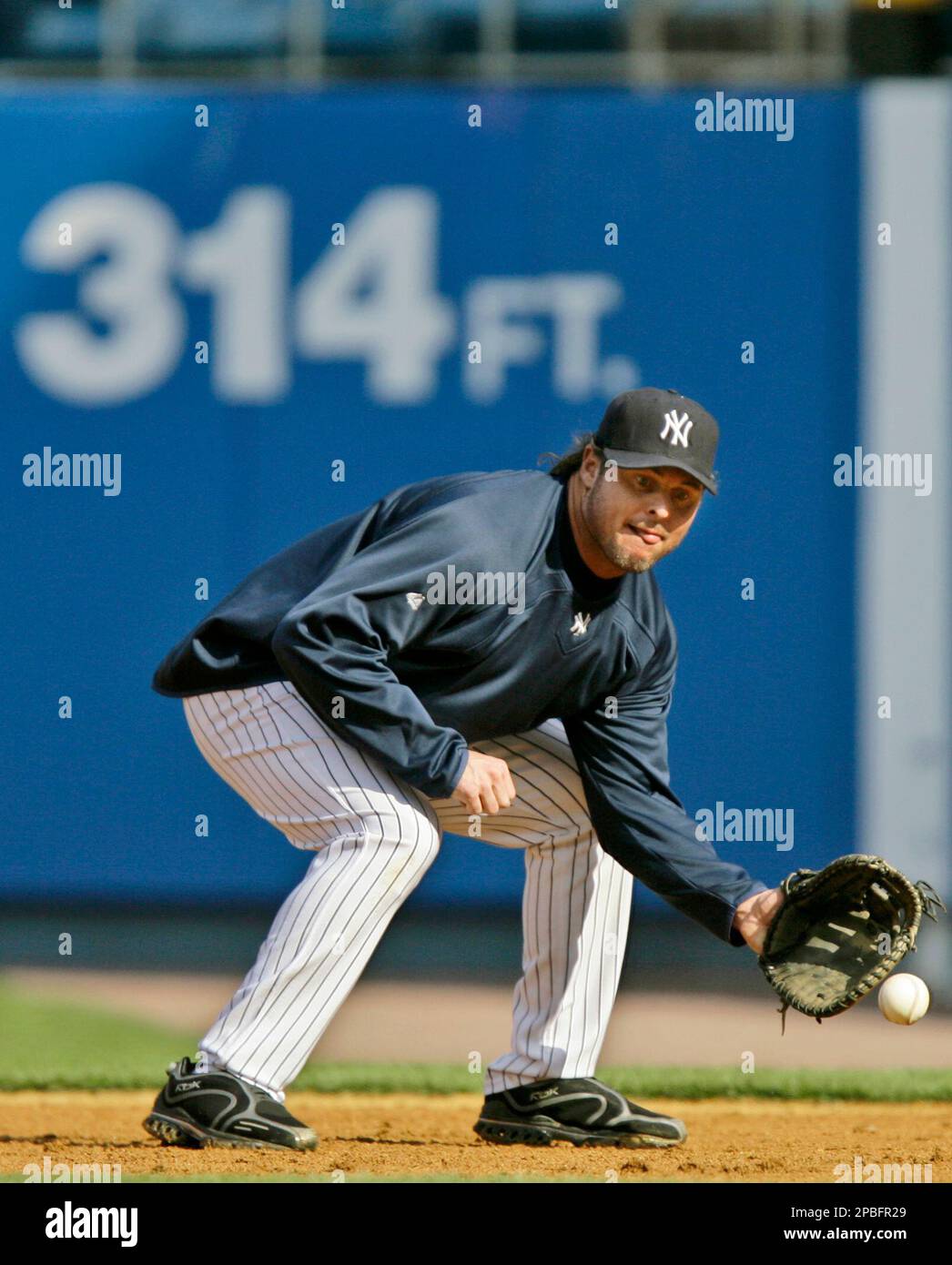 New York Yankees designated hitter Jason Giambi takes ground balls
