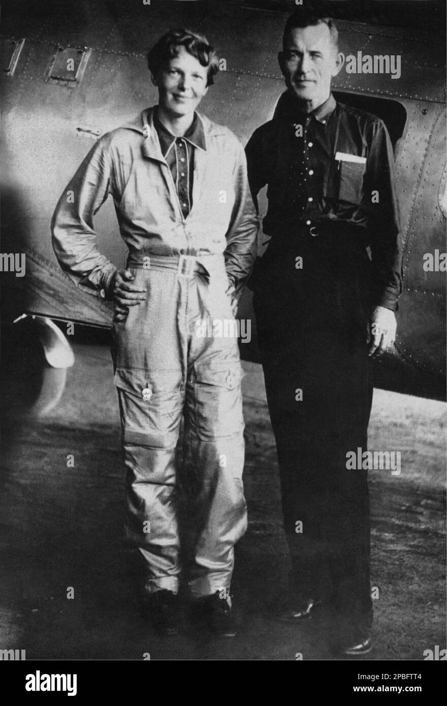 1937, USA  :  Portraits of  most celebrated woman aviator AMELIA EARHART ( 1897 - 1937 ) and her navigator FRED NOONAN , took off on a round-the-world flight that may have ended on Nikumaroro 's freef flat . Earhart was the first woman to receive the Distinguished Flying Cross which she was awarded as the first aviatrix to fly solo across the Atlantic Ocean.  She set many other records, wrote best-selling books about her flying experiences, and was instrumental in the formation of The Ninety-Nines, an organization for female pilots.  During an attempt to make a circumnavigational flight of the Stock Photo