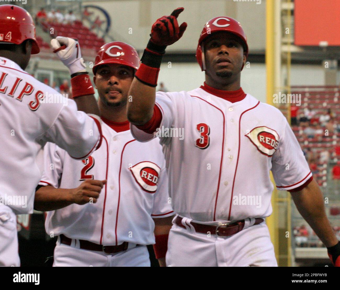 Cincinnati Reds' Ken Griffey Jr. (3) is congratulated by Alex Gonzalez (2)  after Griffey hit a two-run home run off Milwaukee Brewers pitcher Dave  Bush in the second inning of a baseball