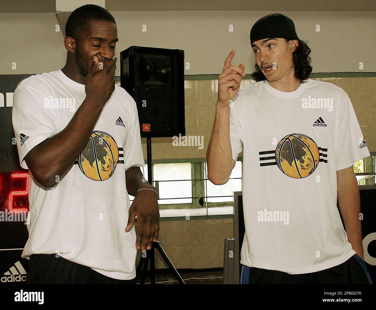 NBA stars Adam Morrison of the Charlotte Bobcats, right, and Martell  Webster of the Portland Trail Blazers chat before a press conference of the  Adidas superstar camp Tuesday, May 22, 2007 in