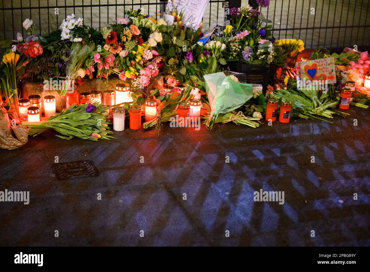 Hamburg, Germany. 12th Mar, 2023. Flowers and candles in front of the