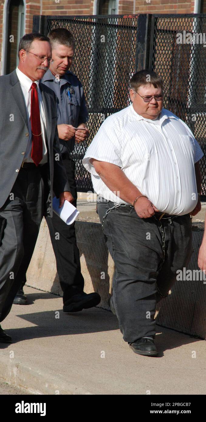 Former South Dakota state Rep. Ted Klaudt, of Walker, S.D., is escorted