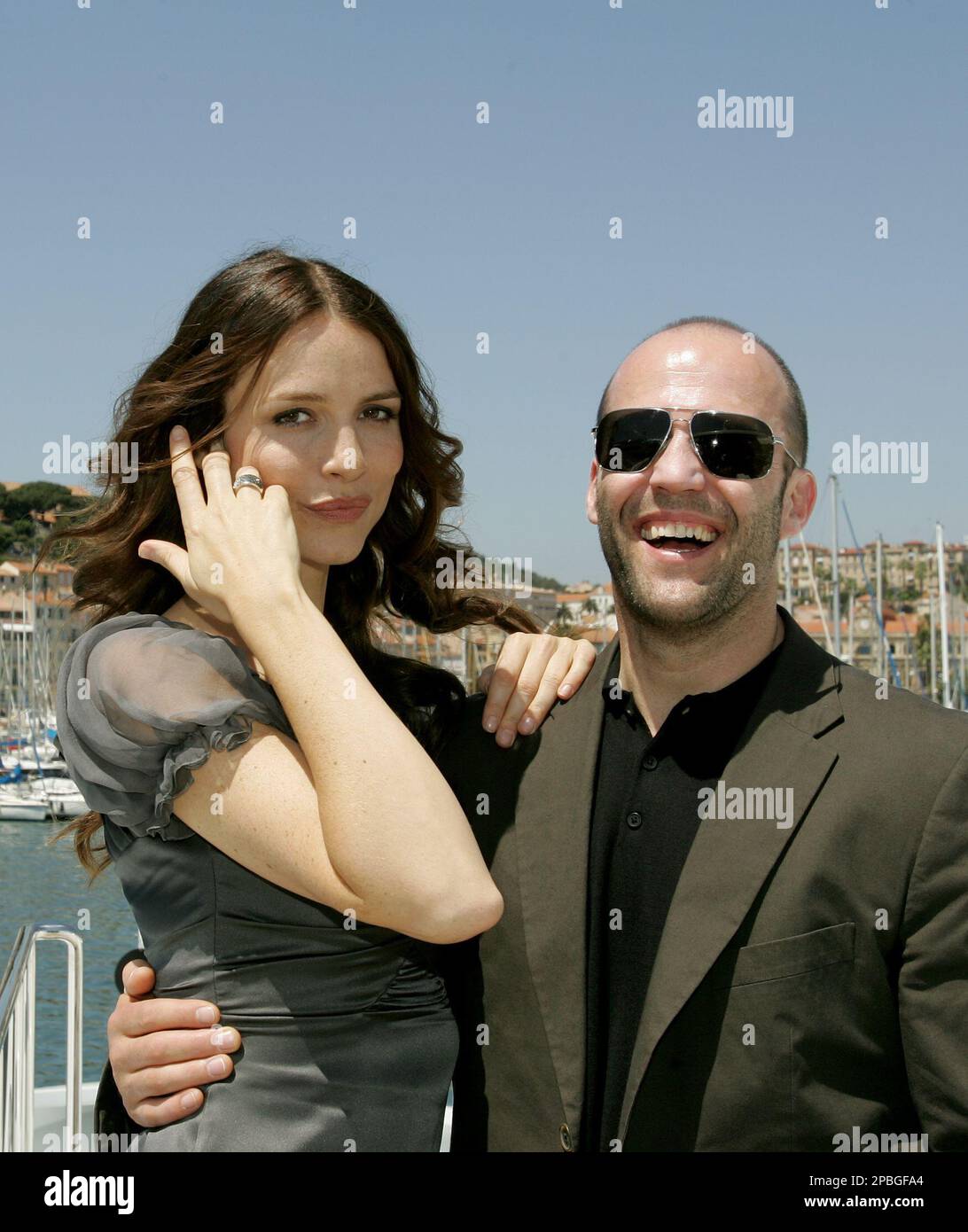 British actors Saffron Burrows, left, and Jason Statham pose during a photo call for the film