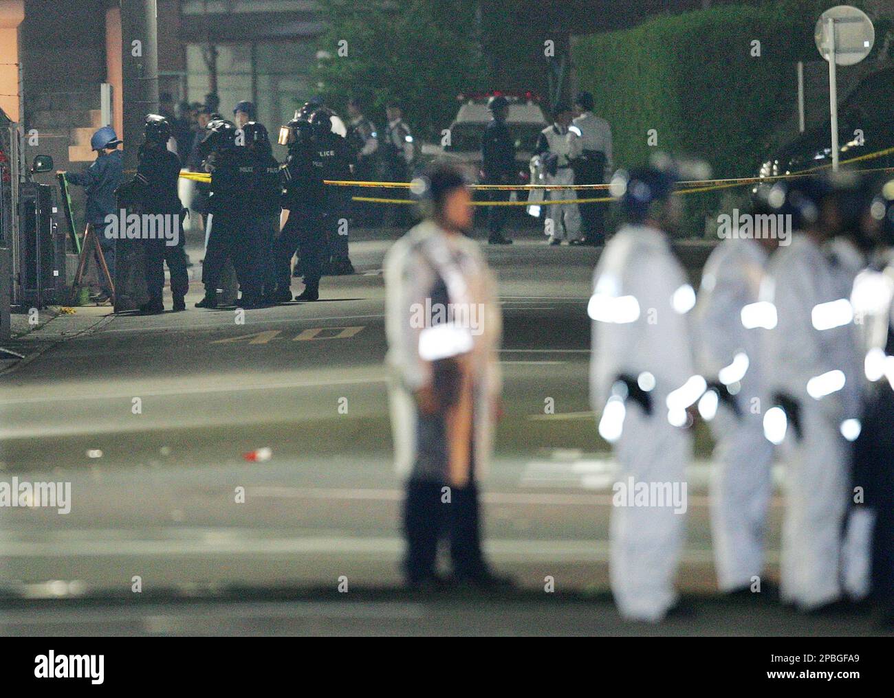 Japanese Police Officers Surround A House Where An Armed Man Went ...