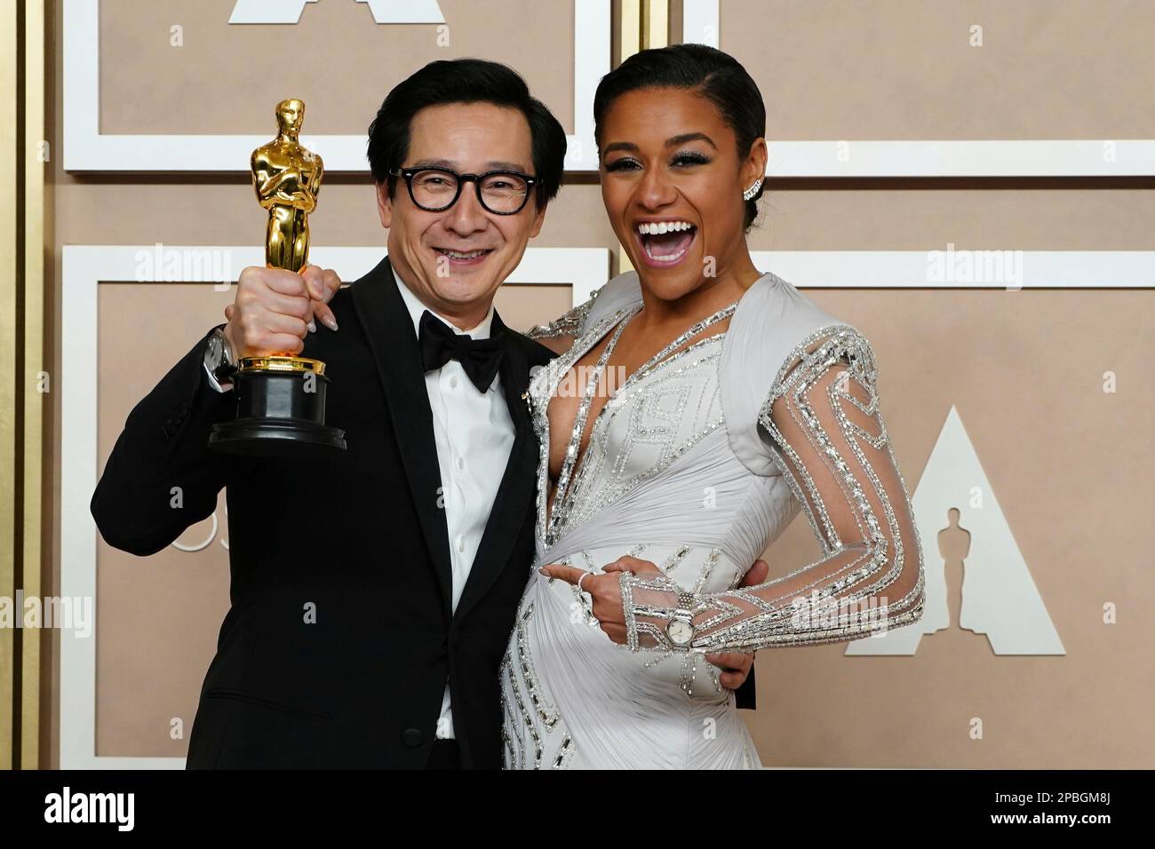 Ke Huy Quan, left, winner of the award for best performance by an actor