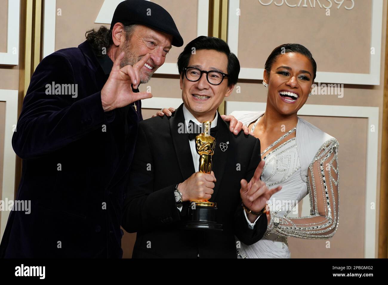 Ke Huy Quan, center, winner of the award for best performance by an