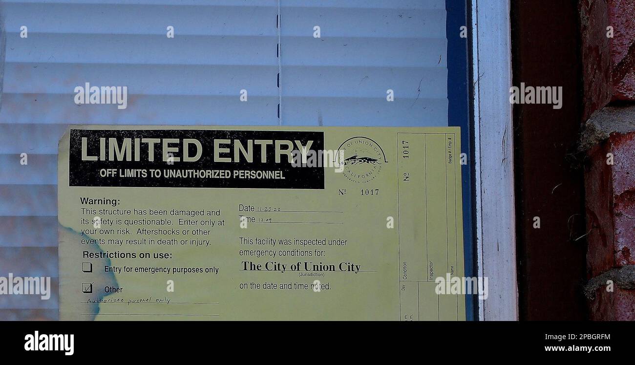 limited entry warning on fire damaged building in California Stock Photo