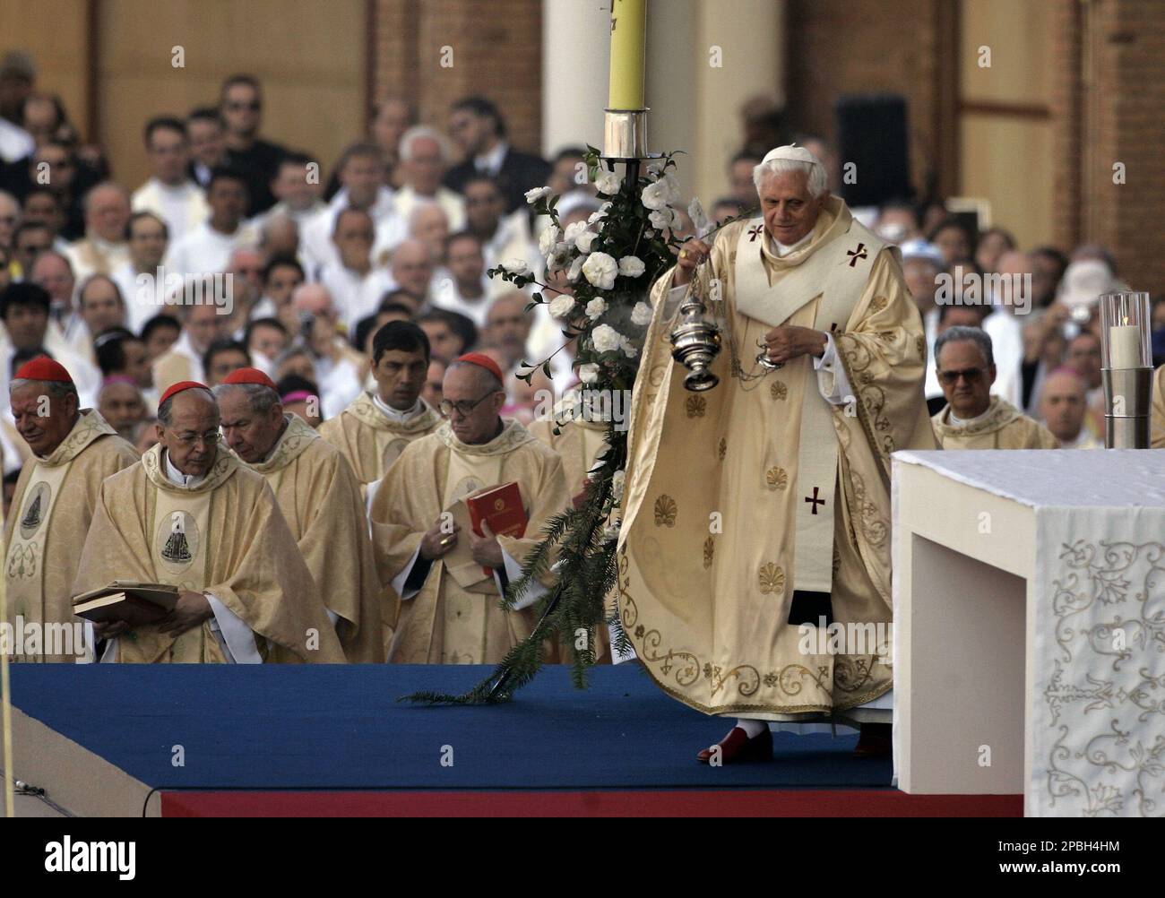 Pope Benedict XVI spreads incense around the altar at the opening mass
