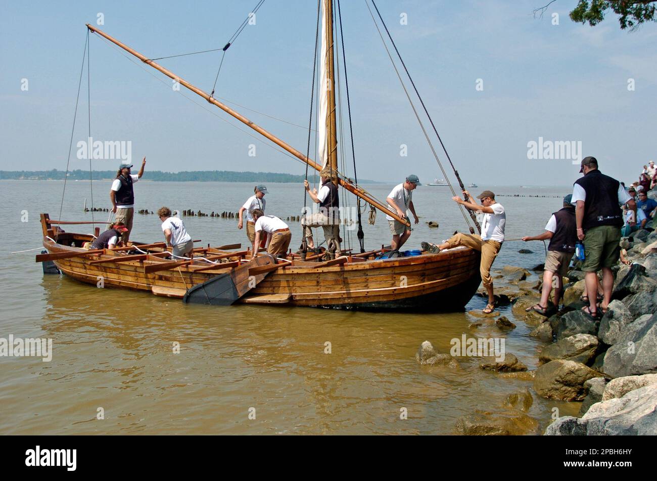 The crew members of a replica of the boat used by Captain John Smith in ...