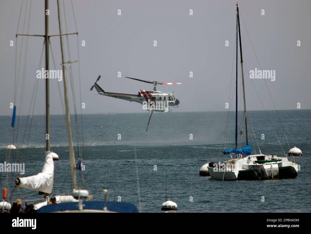 A California Department of Forestry firefighting helicopter scoops up