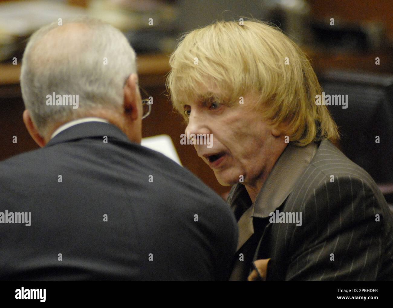 Music producer Phil Spector, center, speaks with defense attorney Roger ...