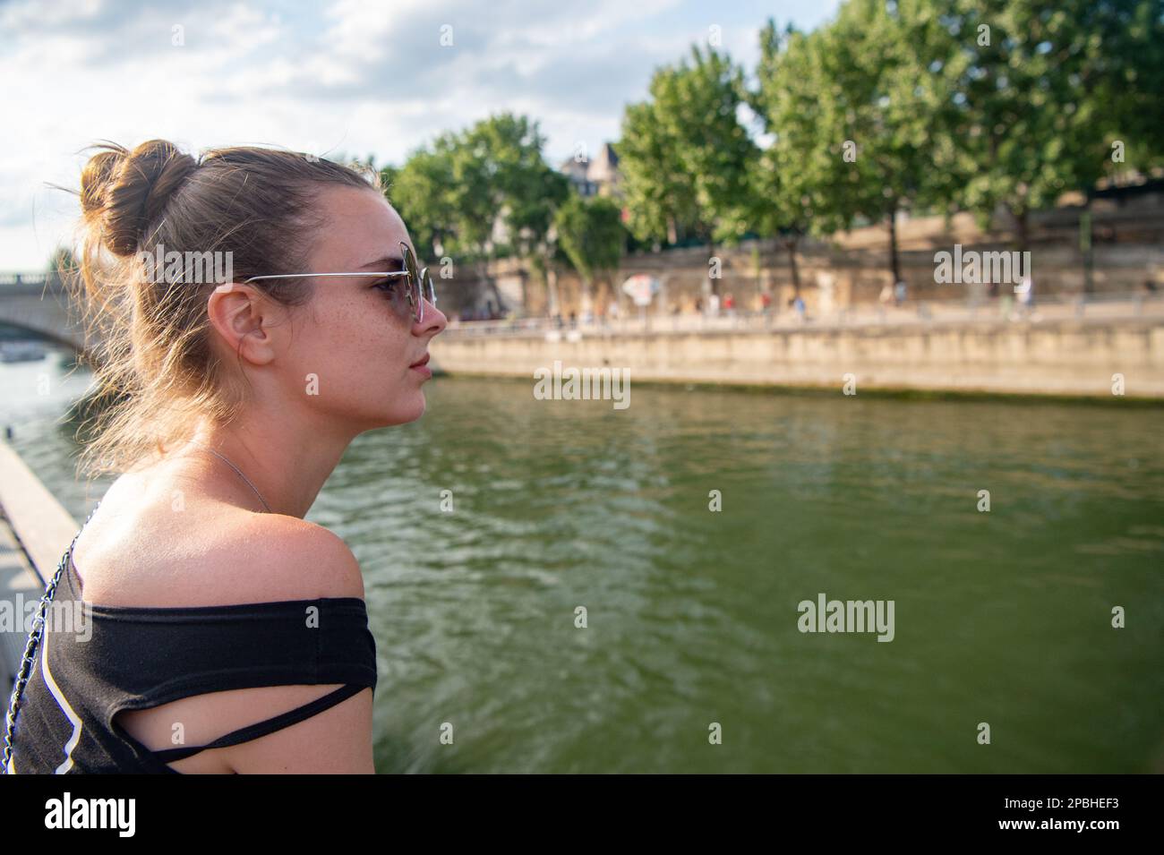 woman at riverbank destination. portrait of woman at riverbank ...