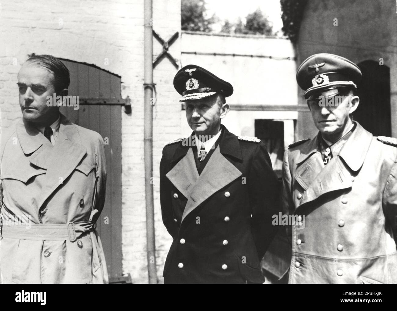 1945 , 23 may , GERMANY  : The german SS architect and Minister of Armaments ALBERT SPEER ( 1905 - 1981 ), the Grand Asmiralnaval Commander  KARL DOENITZ ( 1891 - 1980 , nomined Fuhrer of 3nd Reich after the death of Adolf Hitler , for 20 days ) and the Chief of the Operations Staff of the Armed Forces High Command Colonel General ALFRED JODL ( 1890 - 1946 ), photographed at General Quarter of BRITISH army after the capture . Jodl signed the instruments of unconditional surrender on May 7, 1945 in Reims as the representative of Karl Donitz . Only Alfred Jodl at Nuremberg judgement  was tried, Stock Photo