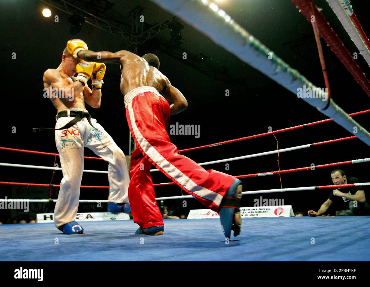 Boxer of the Club pugilistique de Carouge, Patrick Kinigamazi, right,  fights against French Bertrand Fleuret, left, in the final of the european  Kickboxing Full Contact championships during a Gala in Geneva, this