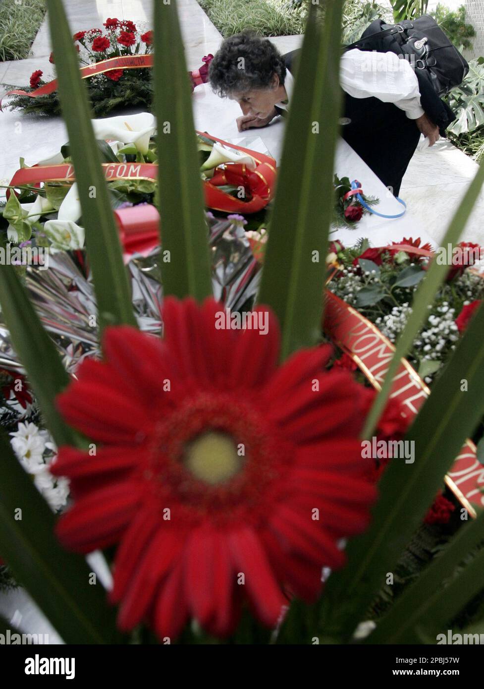 Supporter of former Yugoslav President Josip Broz Tito kisses his tomb ...