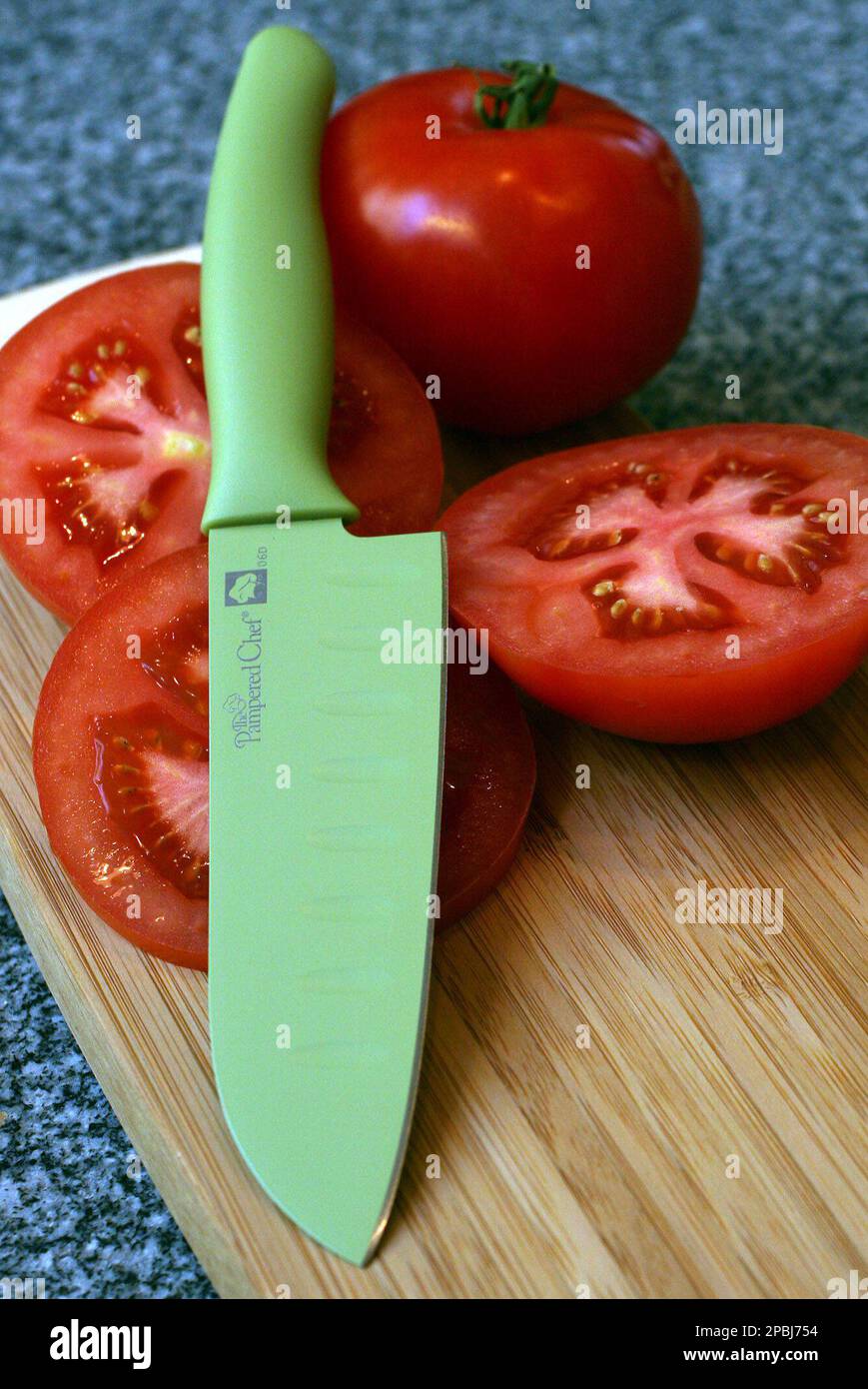 https://c8.alamy.com/comp/2PBJ754/for-use-with-ap-weekly-features-this-color-coated-santoku-knife-from-the-pampered-chef-is-light-weight-and-will-fit-well-in-smaller-hands-ap-photolarry-crowe-2PBJ754.jpg
