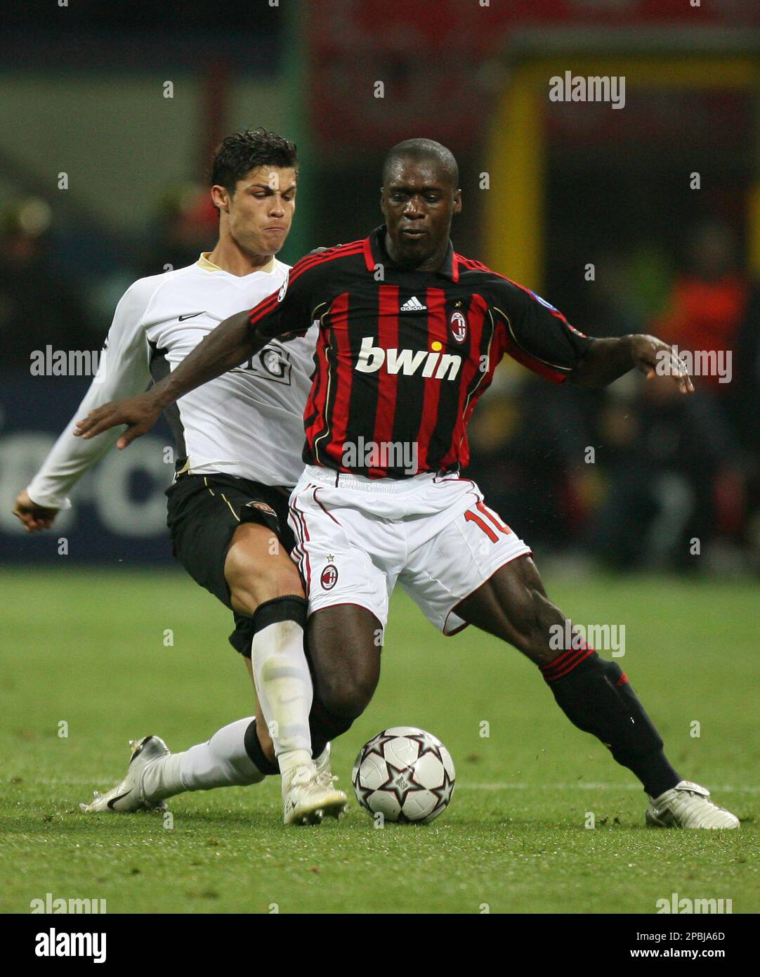 Milan's Clarence Seedorf, right, is tackled by Manchester United's  Cristiano Ronaldo earning the latter a yellow card in the process during  their Champions League semifinal second leg soccer match at the San