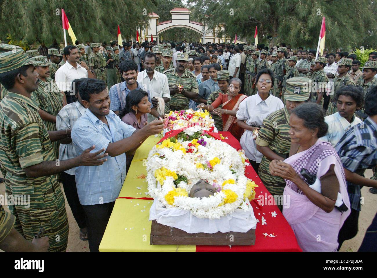ADVANCE FOR SUNDAY, MAY 6 ** Family members and Tamil rebels pay last  respects to Eliyathambi Kathrchewan, a Tamil Tiger rebel known as Lt. Col  Arjunan, at the Viswamadu cemetery near